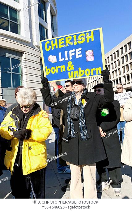 A woman holds up a sign in the Pro-Life rally
