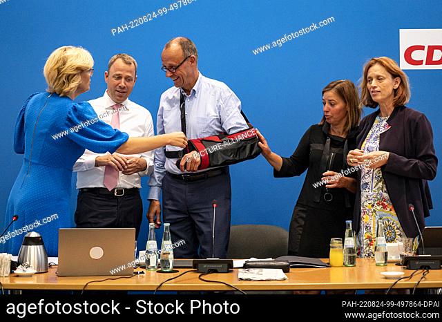 24 August 2022, Berlin: Julia Glöckner (CDU, l-r), member of the German Bundestag, Mario Czaja, CDU Secretary General, Friedrich Merz, CDU leader, Yvonne Magwas