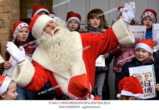 Santa speaks to children during the opening of Germany's largest Christmas post office in Himmelpfort, Germany, 07 November 2013