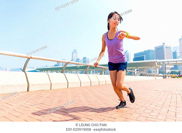 Woman checking the record of running