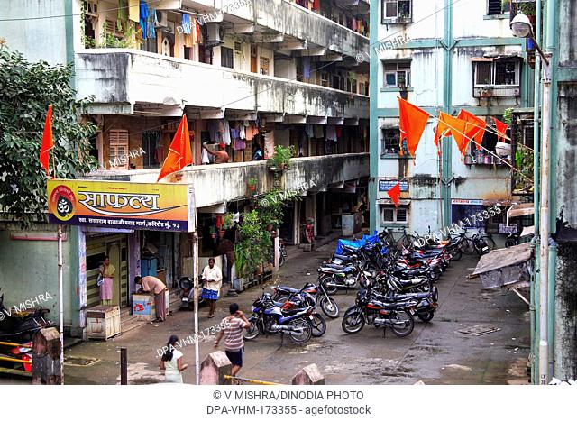 Flag and motorcycles parked in saphaly society ; Sakharam Balaji Pawar Marg ; Curry Road ; Bombay Mumbai ; Maharashtra ; India 26-August-2009