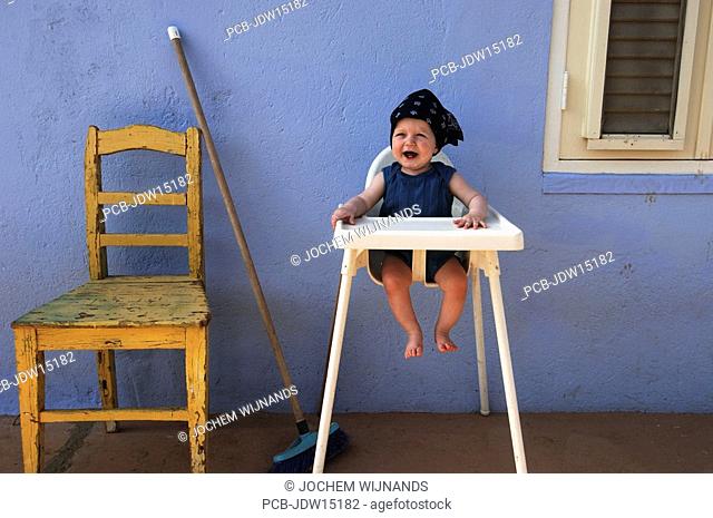 Netherlands Antilles, Curacao, a baby boy waiting for his food