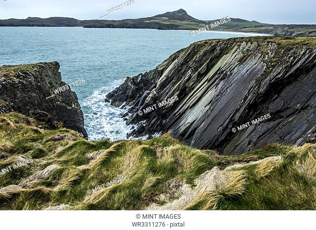 View along the coastline with rocky cliffs, Pembrokeshire National Park, Wales, UK
