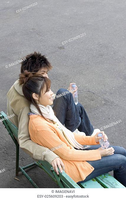 Young couple sitting on the bench