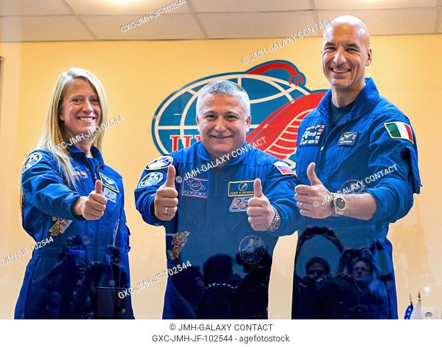 Expedition 3637 Soyuz Commander Fyodor Yurchikhin of the Russian Federal Space Agency (Roscosmos), center, and Flight Engineers Karen Nyberg of NASA, left