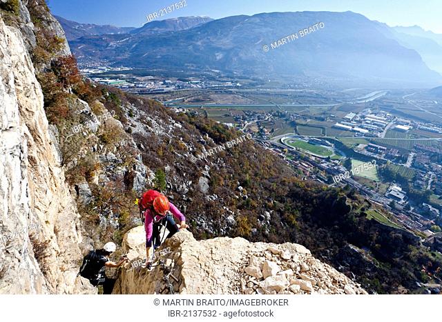 Climbers during the ascent to Monte Albano on the fixed rope climbing route above Mori, Lake Garda hills, Rovereto, Trento, Italy, Europe