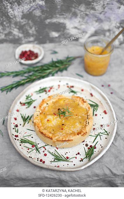 Christmas duck shortcrust pie topped with orange-rosemary jam and rose pepper
