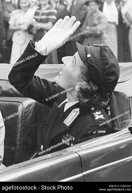 Lady Louis Mountbatten waving to the crowd as she left the Australia Hotel yesterday after the luncheon given in her honor by the Red Cross Society and St