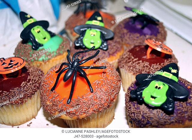 fancy buns decorated with spiders and witches