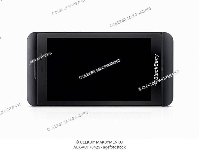 Blackberry Z10 smartphone with blank screen lying on its side isolated on white background with clipping path