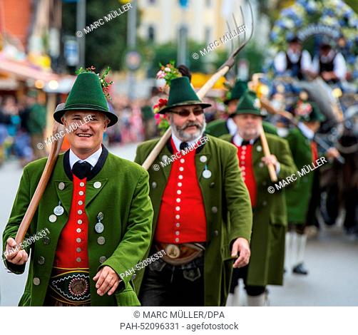 Men wearing traditional costumes participate in the costume and shooting club parade at the Oktoberfest in Munich (Bavaria), Germany, 21 September 2014