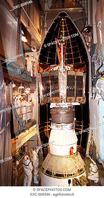 06/26/2001 -- Workers at Launch Complex 17-B, Cape Canaveral Air Force Station, watch as fairing moves into position around the Microwave Anisotropy Probe MAP...
