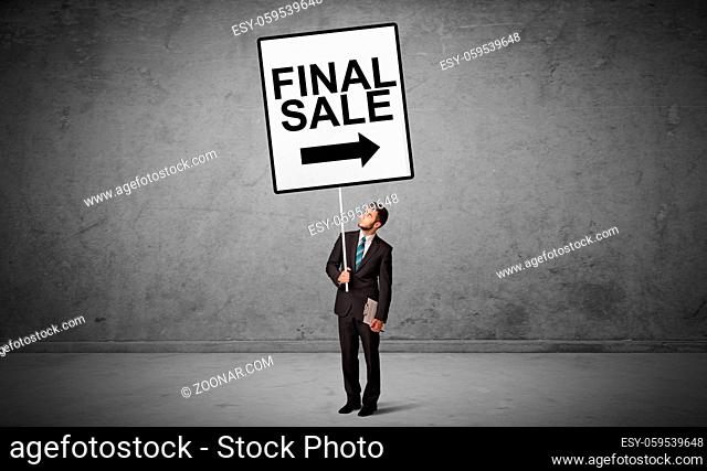 business person holding a traffic sign with FINAL SALE inscription, new idea concept