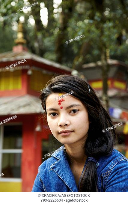 Portrait of a teenage girl with a Hindu tilaka marking at Tiger Hill