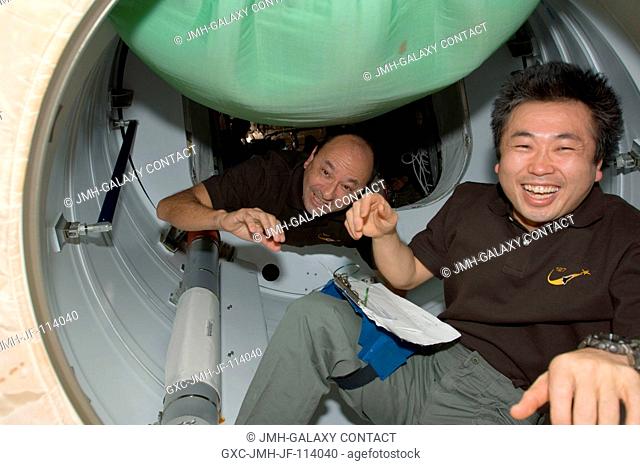 NASA astronaut Mark Polansky (background), STS-127 commander; and Japan Aerospace Exploration Agency (JAXA) astronaut Koichi Wakata, mission specialist