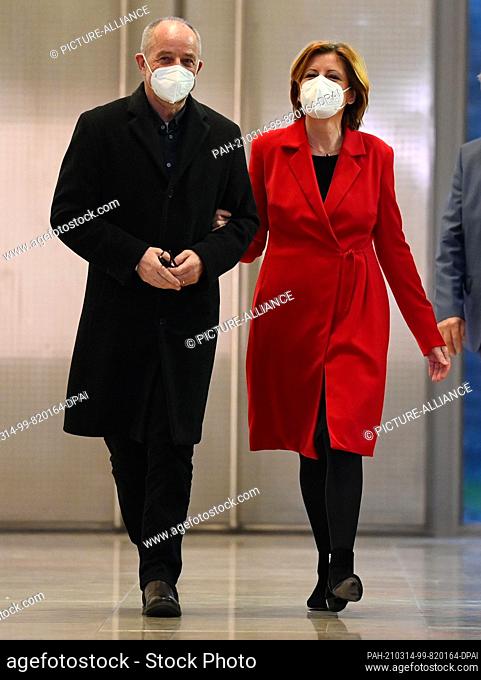 14 March 2021, Rhineland-Palatinate, Mainz: SPD top candidate Malu Dreyer and her husband Klaus Jensen go to a press conference after the first forecasts for...