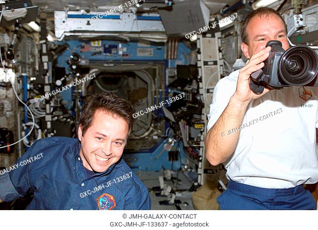 Astronauts Michael J. Bloomfield (right), STS-110 mission commander, and Daniel W. Bursch, Expedition Four flight engineer