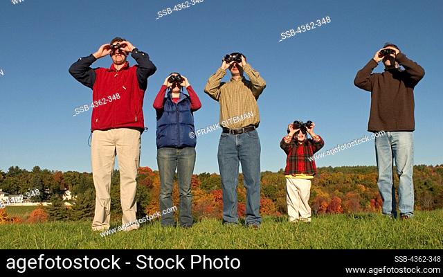 People Looking Through Binoculars