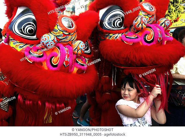 (180216) -- YANGON, Feb. 16, 2018 () -- A girl plays during the Chinese Lunar New Year celebration in the Chinatown of Yangon, Myanmar, Feb. 16, 2018