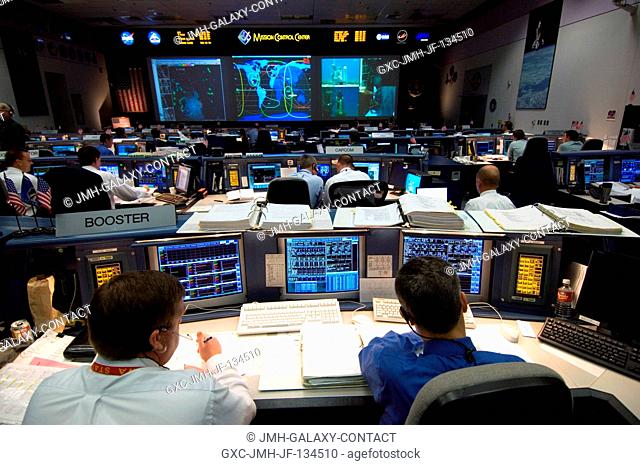 From the point of view of the Booster Console, this image provides an overall perspective of the Shuttle (White) Flight Control Room of Houston's Mission...