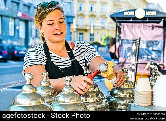Ice-cream seller sells scoop of ice cream in Brno, Czech Republic, October 4, 2023. (CTK Photo/Patrik Uhlir)