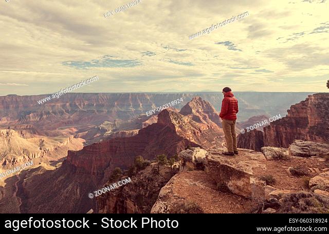 Traveler on cliff mountains over Grand Canyon National Park, Arizona, USA.Inspiring emotion. Travel Lifestyle journey success motivation concept adventure...