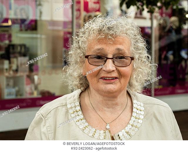 Woman with curly grey hair