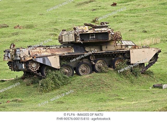 Damaged tank target on military firing range, overgrown with Brambles Rubus fruticosus, Dorset, England, september