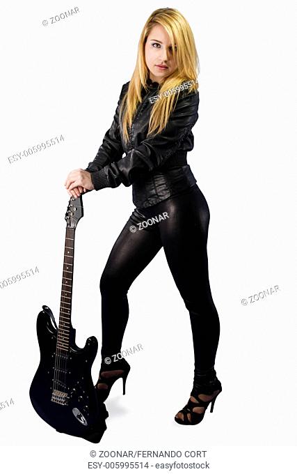 Sexy young blonde dressed in black leather with electric guitar on white background