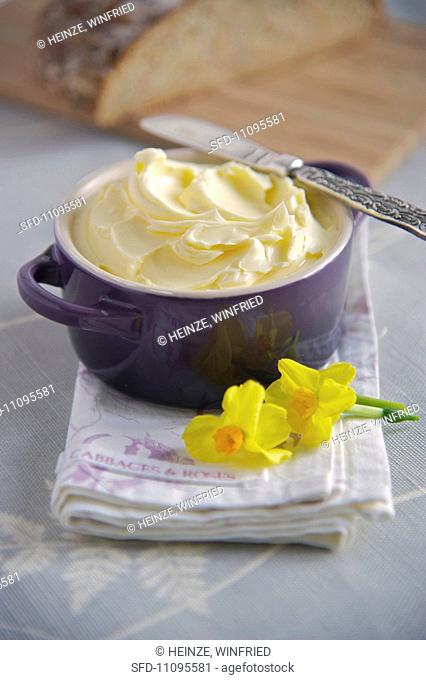 Freshly made butter in a ceramic pot