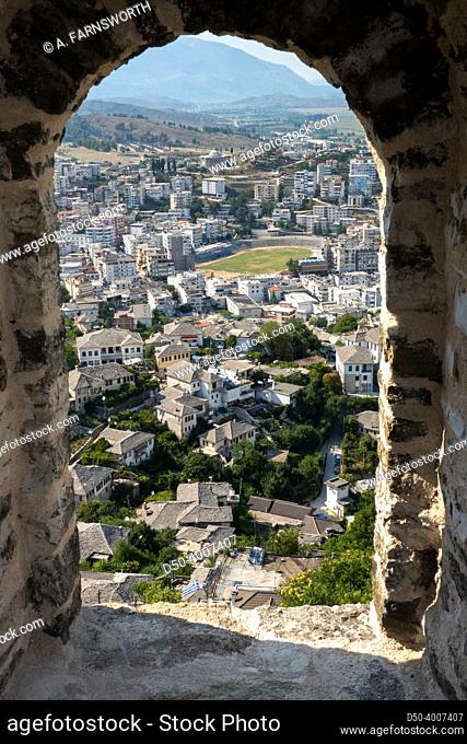 Gjirokaster, Albania A view of the. city through the ramparts of the Gjirokaster Castle, a Unesco site