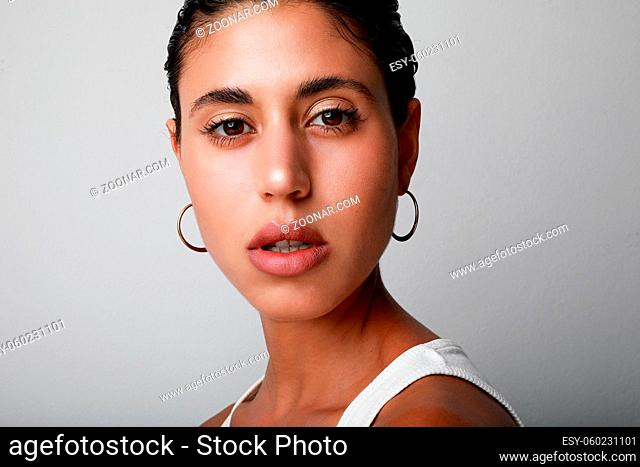 Portrait of young woman with perfect glowing skin. Isolated. High quality photo