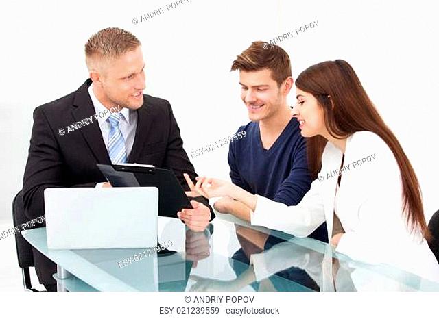 Couple Discussing With Financial Advisor