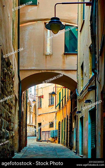 Old narrow street near the Old Port in Genoa, Italy