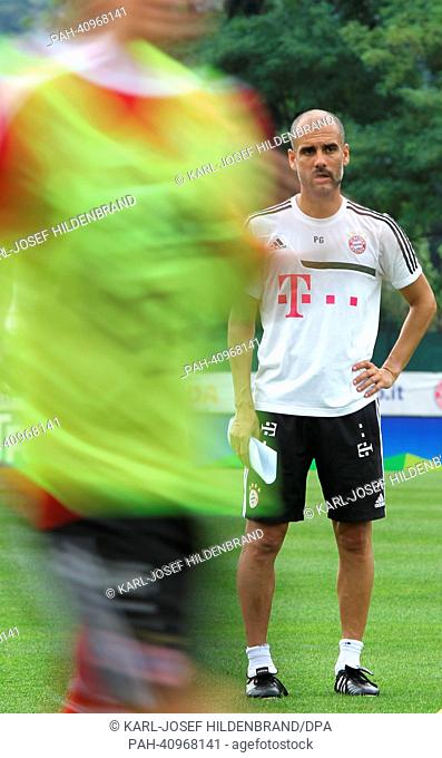 Players of FC Bayern Munich train watched by coach Pep Guardiola in Arco, Italy, 10 July 2013. From 04 July to 12 July 2013 the Bundesliga soccer team prepares...