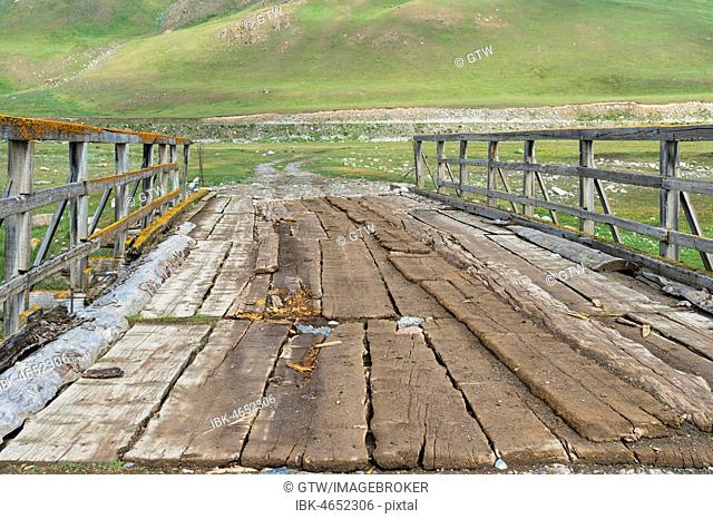 Old wooden bridge over a Mountain river, Naryn gorge, Naryn Region, Kyrgyzstan
