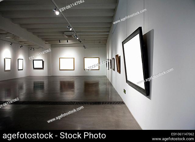 A blank picture frame in the exhibition room high quality photo