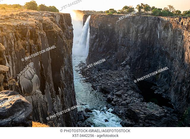 Victoria Falls, Named by David Livingstone in 1855 after Queen Victoria, The waterfall is formed by the Zambezi River falling into a 100 metre deep chasm...