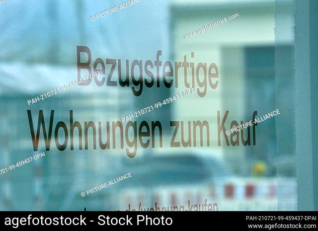 24 June 2021, Saxony, Leipzig: ""Ready to move in apartments for sale"". Various notices hang on a newly built, multi-storey residential building in a direct...