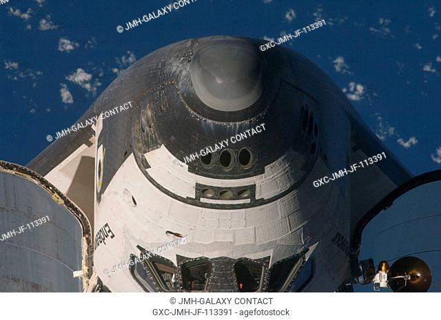 This almost head-on view of the crew cabin of the Space Shuttle Endeavour was provided by an Expedition 20 crewmember during a survey of the approaching vehicle...