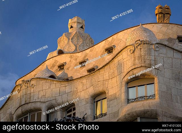 The Casa MilÃ  (La Pedrera) at sunset, twilight and blue hour on the Passeig de Gracia in Barcelona (Catalonia, Spain)