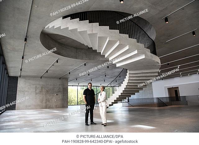 28 August 2019, Berlin: Petra Wesseler, President of the Federal Office for Building and Regional Planning, and architect Stefan Marte stand in the redesigned...