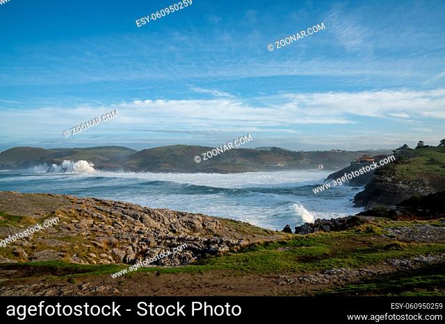 A view of huge waves crashing onto the shores of Cabo de Ajo on the northern Spanish coast