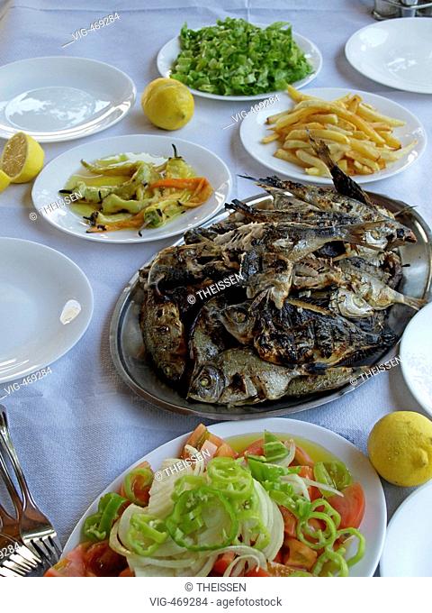 typical Greek meal with grilled fish vegetable and salads. - 01/01/2007