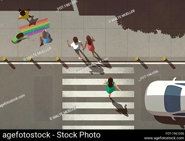 View from above pedestrians crossing street by kids coloring rainbow on sidewalk