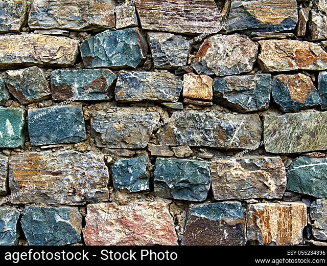 wall of rough stones in the background