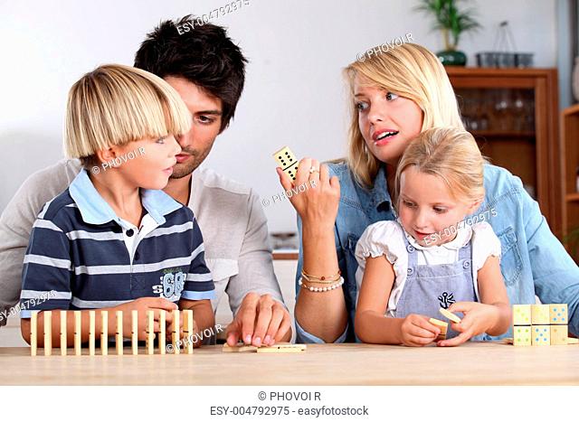 Family playing dominoes