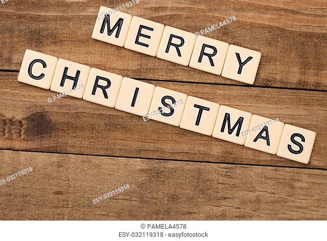 Merry Christmas spelled out in tan tile letters