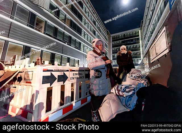 12 March 2022, Hamburg: Two women from Ukraine wait in front of the Hammer Straße registration office. They hold out overnight in order not to lose their place...