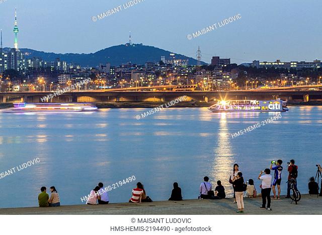 South Korea, Seoul, Banpo Bridge view from the Han River and Namsan Park in the background and telecommunications tower N Seoul Tower (1975)